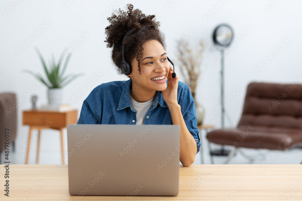 Portrait of happy African American female employee customer support services in headset, online consultation. Woman call center. Female customer support or sales agen - obrazy, fototapety, plakaty 