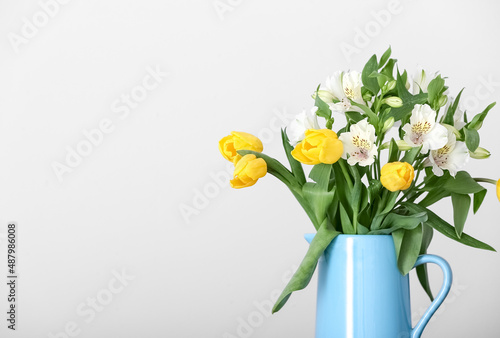 Bouquet of tulips on light background