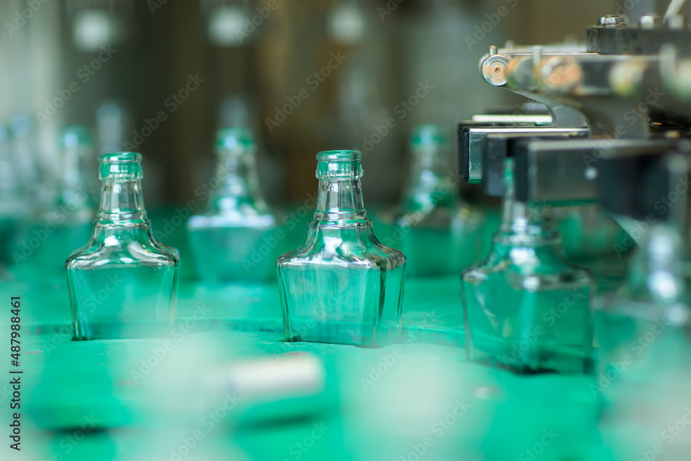 Bottles with a drink closed with a screw cap. Factory for the production of alcoholic beverages Bottles with a drink closed with a screw cap. Factory for the production of alcoholic beverages