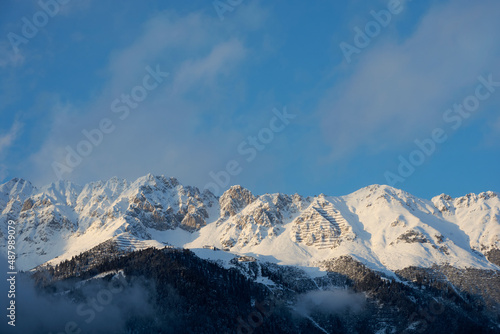 Mountain panorama with snowy mountains and blue sky in the alps