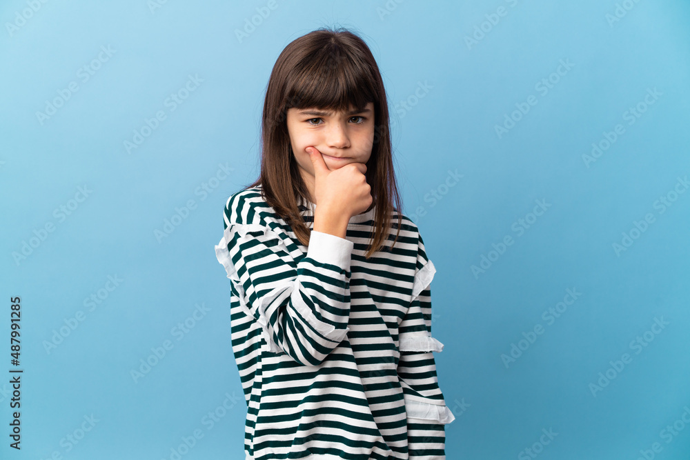 Little girl over isolated background having doubts Little girl over isolated background having doubts