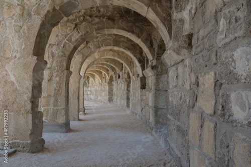 The columned Arch gallery above the auditorium-theatre in the Ancient Roman Theater of Aspendos. Arch in ancient amphitheater.