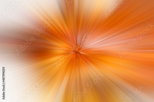 Golden orange motion blur, with glowing light to the left