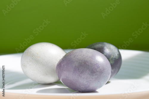 Beautiful colorful Easter eggs on a green background