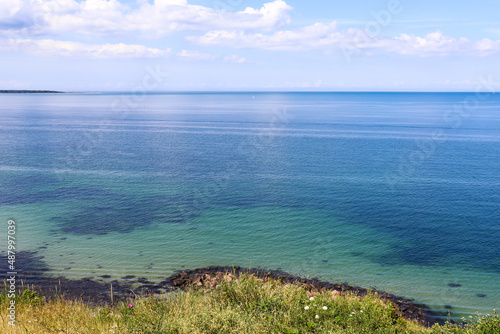 Fototapeta Naklejka Na Ścianę i Meble -  Natural and sea landscape. Beautiful beach blue sea water. Blue sky background. Sea skyline. High quality photo