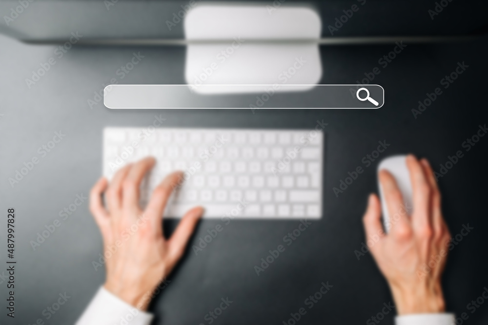 Searching internet. Online website search engine selective focus. Blured hands using computer for searching browsing internet data information networking concept. Searching internet. Online website search engine selective focus. Blured hands using computer for searching browsing internet data information networking concept.