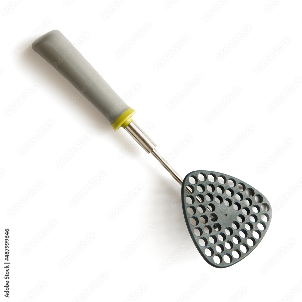 Folding potato masher on white background, close up Folding potato masher on white background, close up