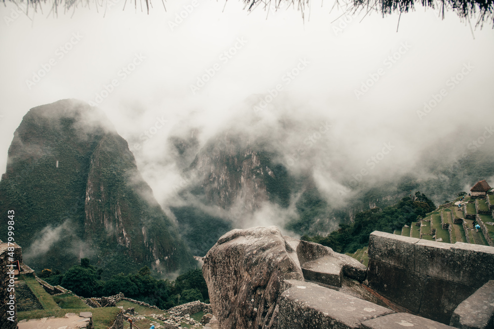 The site of machu picchu on a cloudy day