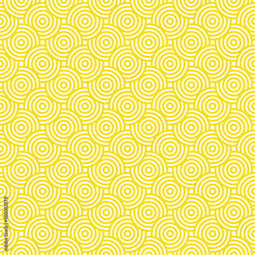 Abstract vector background of bright yellow circles overlapping each other on white background. Seamless pattern. Modern, colorful, vibrant background. Summer, cheerful. Copy space.