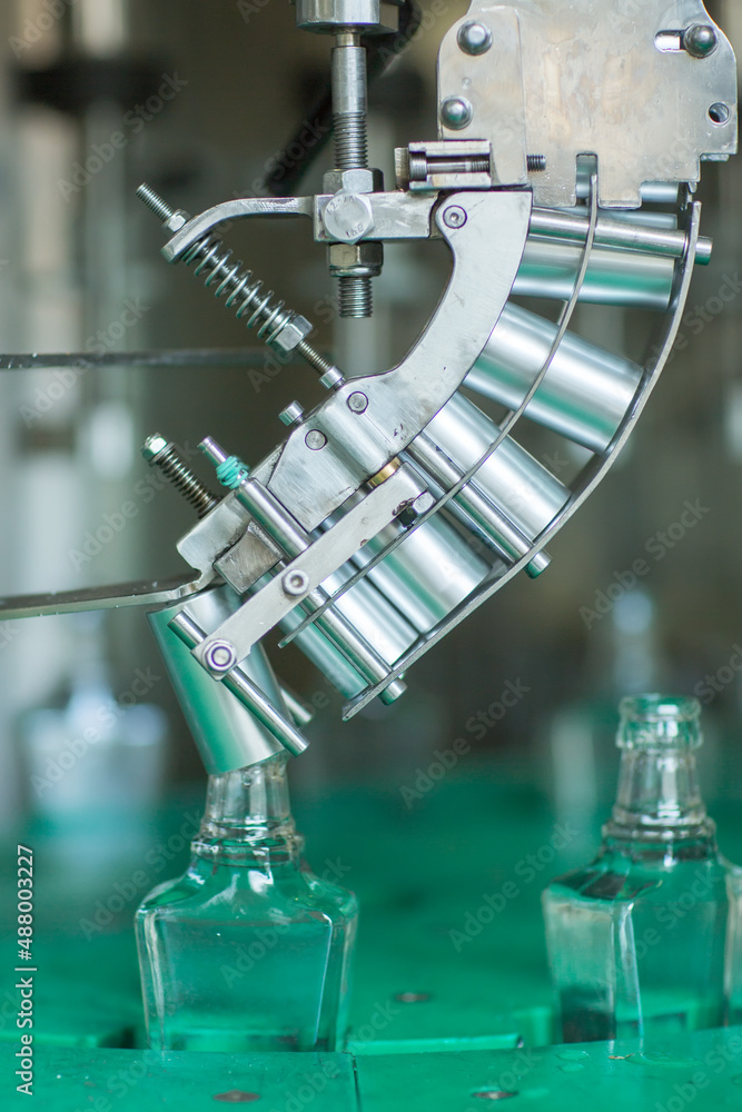 Bottles with a drink closed with a screw cap. Factory for the production of alcoholic beverages Bottles with a drink closed with a screw cap. Factory for the production of alcoholic beverages