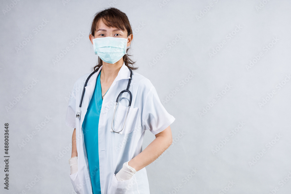 Covid19, coronavirus, healthcare and doctors concept. Portrait of professional confident young asian doctor in medical mask and white coat, stethoscope over neck, ready help patient, fight disease Covid19, coronavirus, healthcare and doctors concept. Portrait of professional confident young asian doctor in medical mask and white coat, stethoscope over neck, ready help patient, fight disease