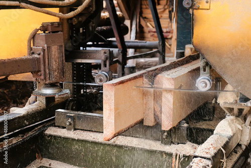 The process of processing boards at the sawmill, close-up.