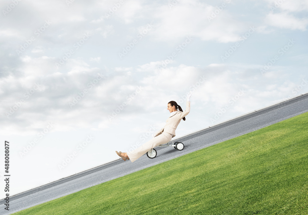 Beautiful happy woman riding downhill Beautiful happy woman riding downhill