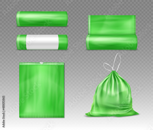 Green plastic bag for trash and garbage.  Green disposable package for rubbish. Vector realistic mockup of polyethylene trash bag isolated on transparent background.