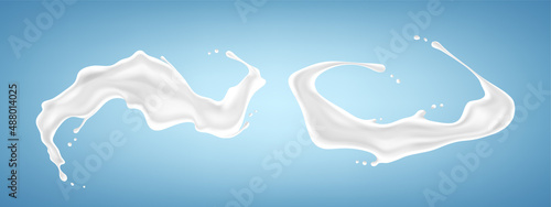 Set of milk splashes isolated on blue background. Vector illustration.