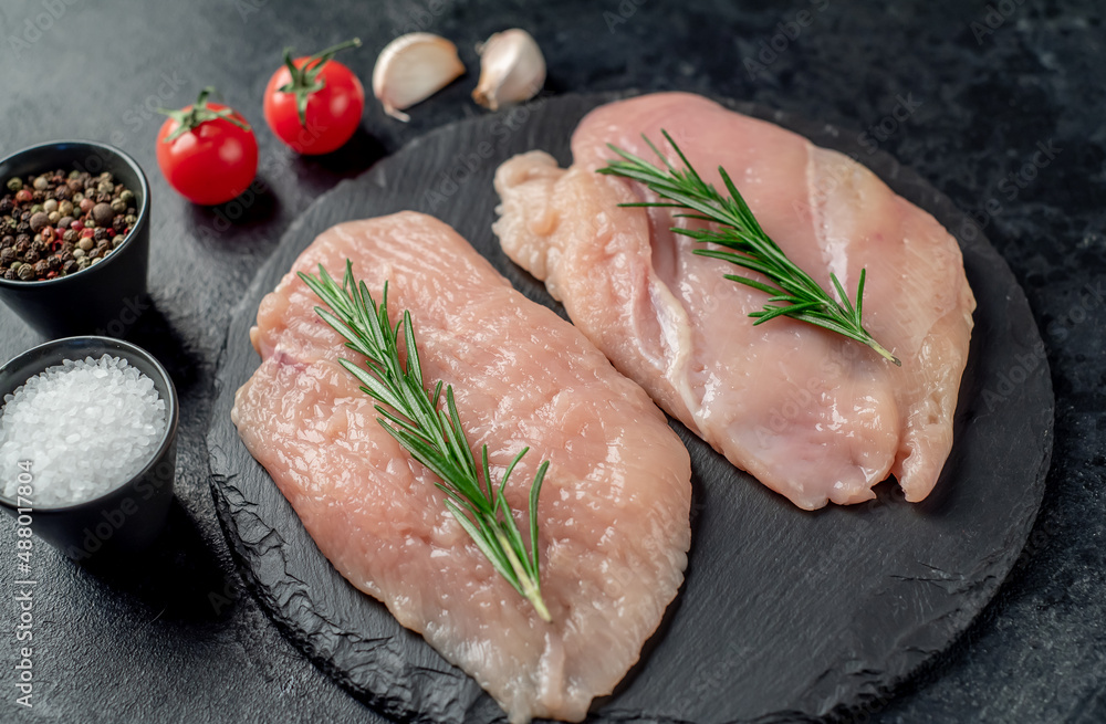 raw chicken chops on stone background raw chicken chops on stone background