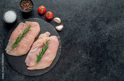 raw chicken chops on stone background with copy space for your text