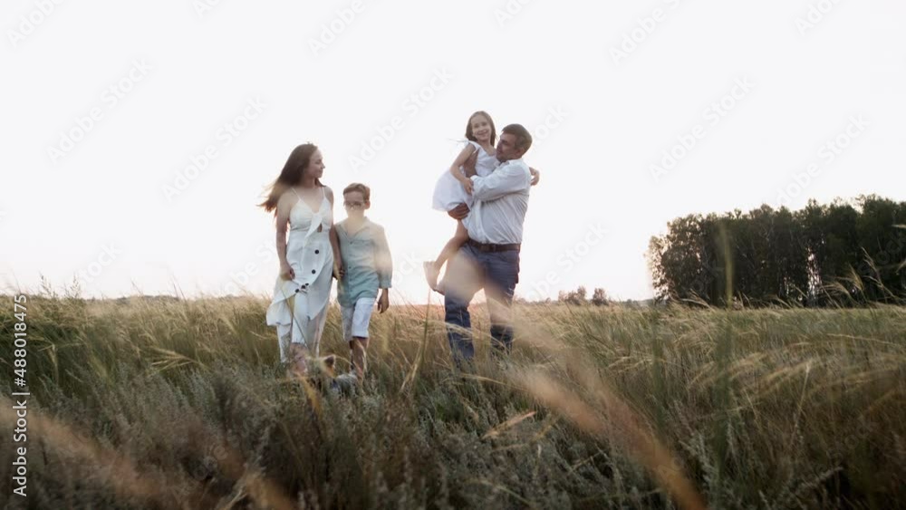 Summer walk and healthy recreation of happy family spending free time outdoors. Summer walk and healthy recreation of happy family spending free time outdoors.