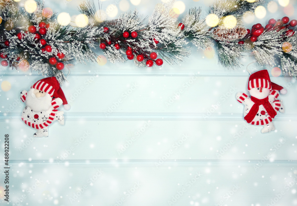 christmas santa toy with fir branches decor and snow