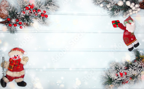 christmas snowman toy with fir branches decor and snow