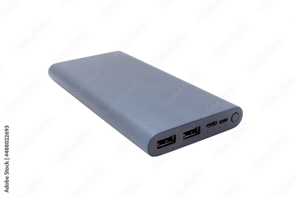 Power bank isolated on white background. External aluminum battery for charging various devices. Power bank isolated on white background. External aluminum battery for charging various devices.