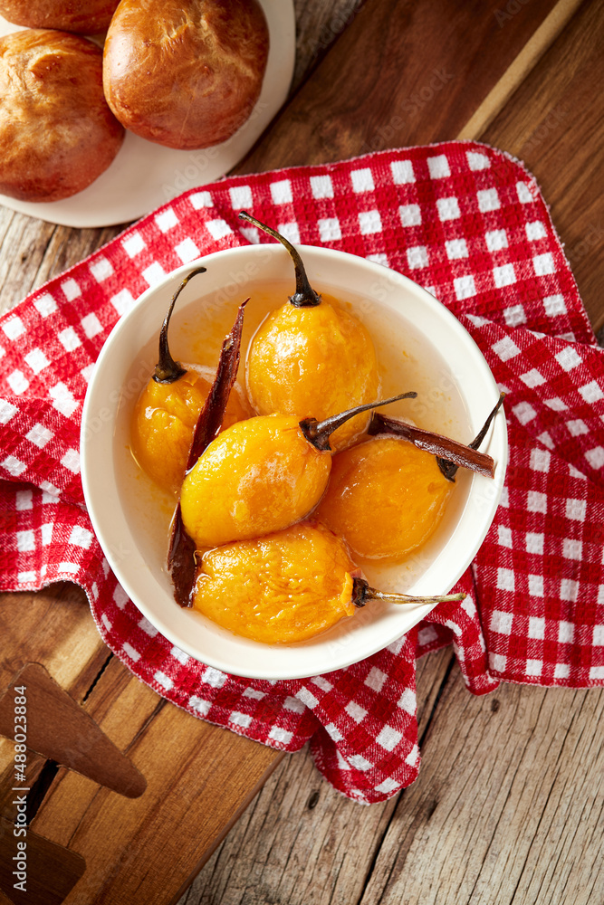 Homemade sweet tomate de árbol, a typical ecuadorian dessert served on a white plate with a rustic, traditional and homey background
Homemade sweet tomate de árbol, a typical ecuadorian dessert served on a white plate with a rustic, traditional and homey background