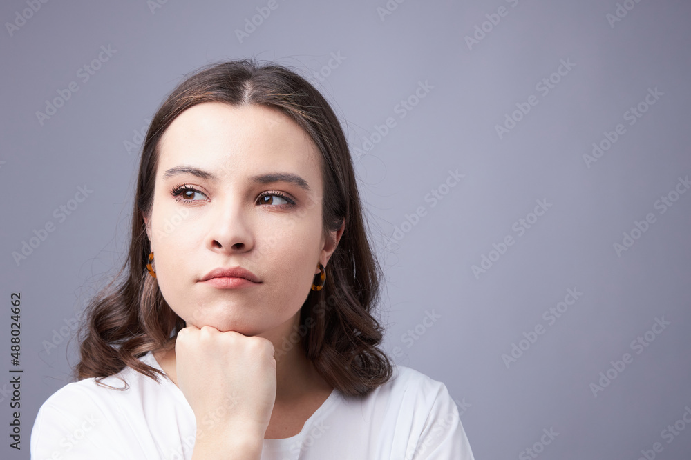 Difficult choice, a young woman makes a difficult decision Difficult choice, a young woman makes a difficult decision