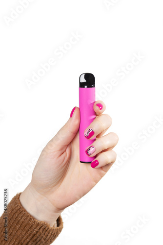 Disposable electronic cigarette in hand close-up on a white background. The concept of modern smoking, vaping and nicotine. Copy space