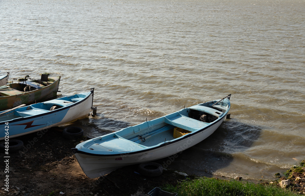 fishing boats by the lake