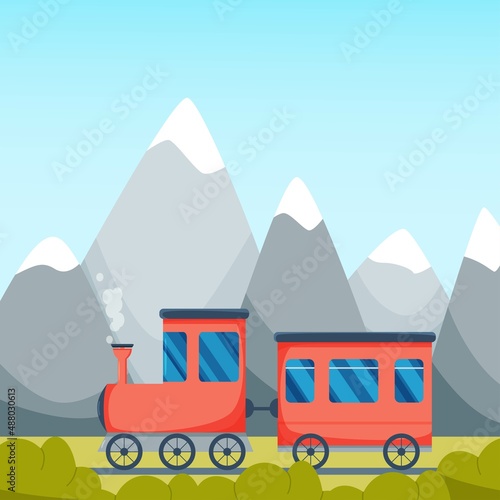 Cute little red train at the mountains background