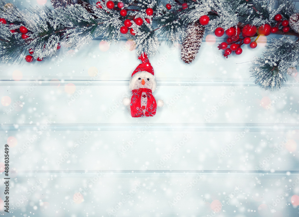 christmas snowman toy with fir branches decor and snow