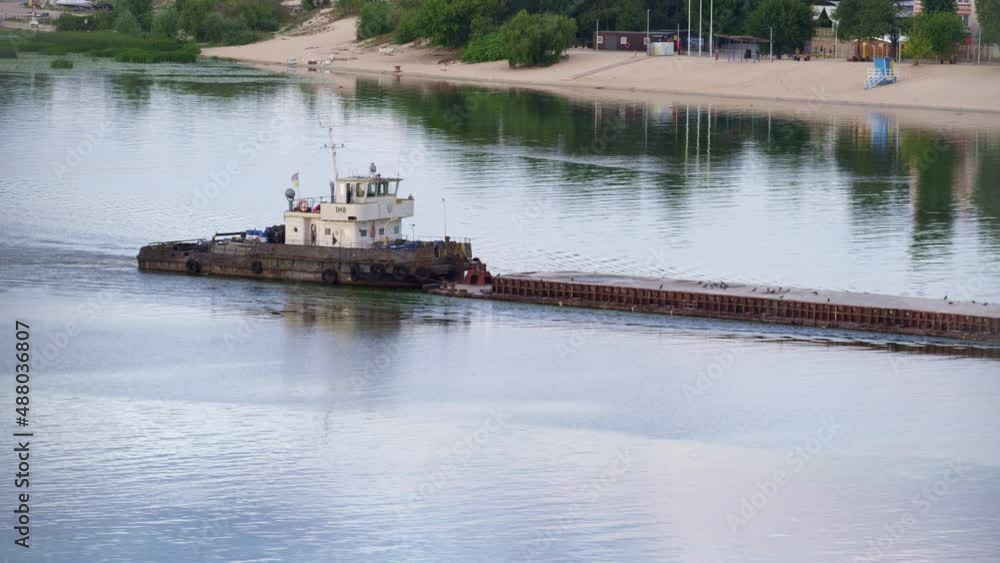 Tug flowing along river daylight drone shot. Tow boat pushing old empty barge. Tug flowing along river daylight drone shot. Tow boat pushing old empty barge.