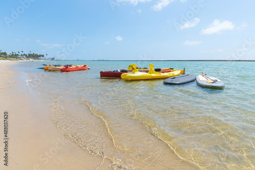 Kayaks at Muro Alto beach, tourist attraction of this famous beach of Ipojuca. Beach with no waves, warm and calm water surrounded by a reef wall.