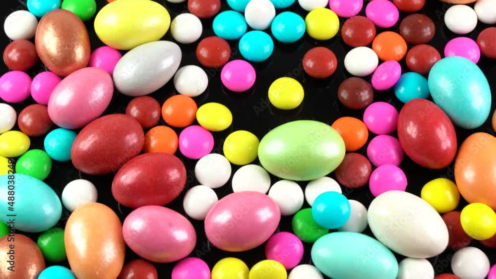Colorful chocolate candies slow motion Colorful chocolate candies slow motion