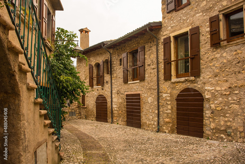 Fototapeta Naklejka Na Ścianę i Meble -  The historic castle quarter, Via Posterna, in winter in the small town of Malcesine on the north shore of lake Garda, Verona Province, Veneto, north east, Italy
