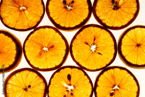 orange slices  orange detail on white backlit background  close up view
