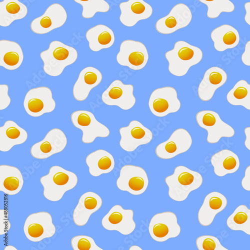 Fototapeta Naklejka Na Ścianę i Meble -  Seamless cartoon pattern with fried eggs in top view on blue background. Cute wrapping paper, wallpaper or web background with breakfast - chicken eggs. Cooking, food, recipe concept.