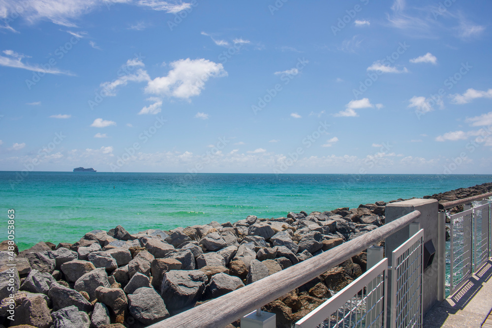 The ocean breakwaters on the south Miami Beaches on a blue sky day The ocean breakwaters on the south Miami Beaches on a blue sky day