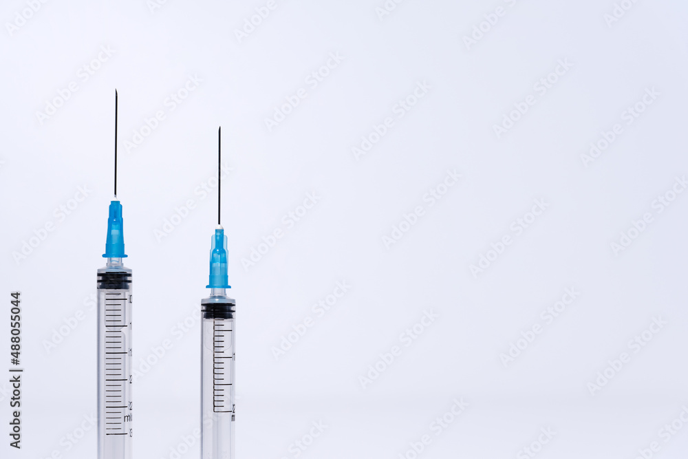 Opened disposable plastic syringes on white background Opened disposable plastic syringes on white background