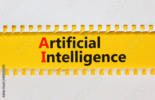 AI artificial intelligence symbol. Concept words AI artificial intelligence on yellow paper on a beautiful yellow table white background. Business AI artificial intelligence concept. Copy space.