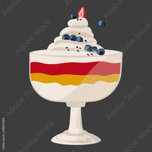 Trifle, an English dessert laid out in layers in a glass glass, decorated with whipped cream, strawberries and blueberries.