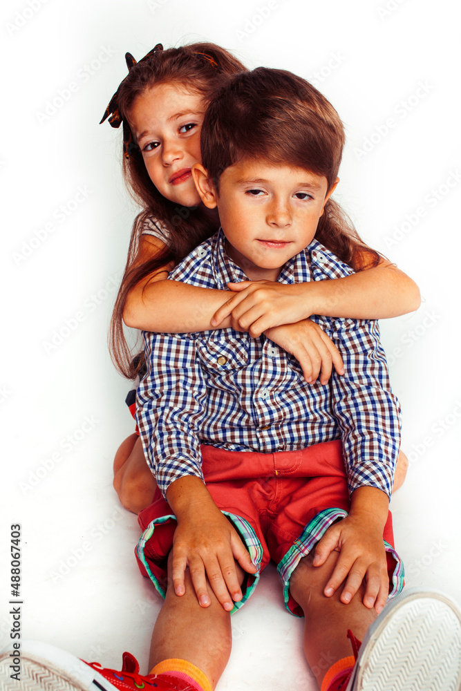 little cute boy and girl hugging playing on white background, happy smiling family, lifestyle