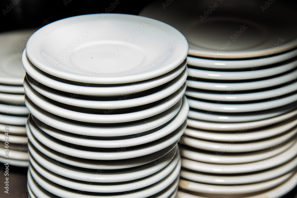 clean dishes from a restaurant on top of each other clean dishes from a restaurant on top of each other