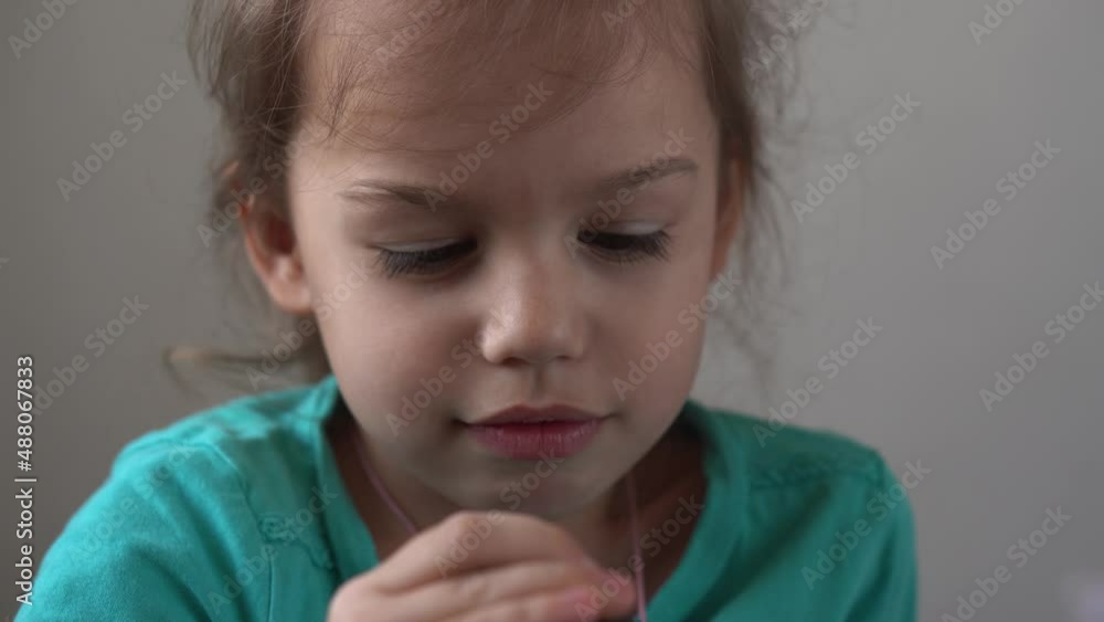 Portrait Funny little preschool girl smiling not combed untidy child looking away thoughtfully sad at home, pretty natural real face. childhood.sincere emotions of ashamed, embarrassed child Portrait Funny little preschool girl smiling not combed untidy child looking away thoughtfully sad at home, pretty natural real face. childhood.sincere emotions of ashamed, embarrassed child
