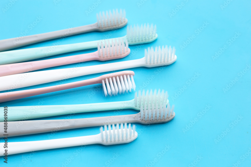 Toothbrushes on blue background. Top view Toothbrushes on blue background. Top view