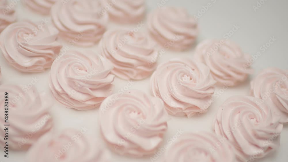 Close up of pink marshmallows. Smooth camera movement, slow motion. Close up of pink marshmallows. Smooth camera movement, slow motion.