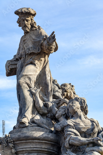 Statue of Ivo of Kermartin on Charles Bridge in Prague, photo