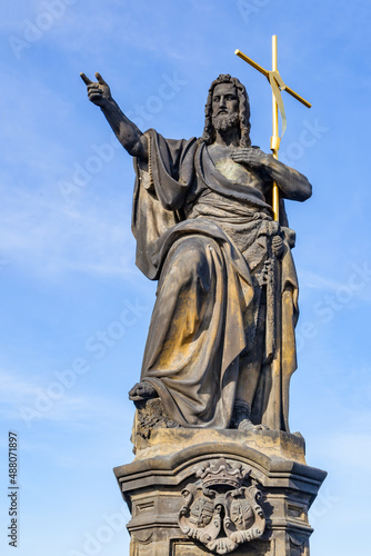 Statue of John the Baptist on Charles Bridge in Prague