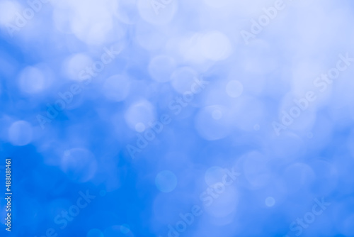 Abstract blurry blue color for background, Blur festival lights outdoor celebration and blue bokeh focus texture decorative design elegant for winner.