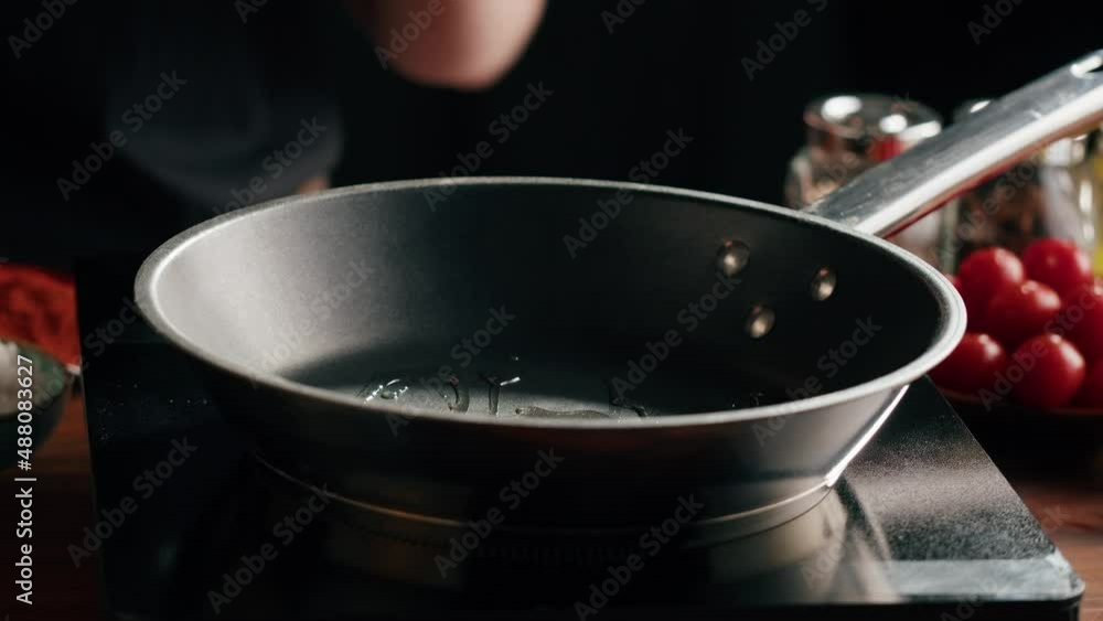 Chef frying pepper in pan close-up. Woman chief cooking dish with grilled vegetables, vegetarian food. Spicy arabian and mexican cuisine. Chef frying pepper in pan close-up. Woman chief cooking dish with grilled vegetables, vegetarian food. Spicy arabian and mexican cuisine.
